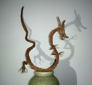 Illustration for article titled Godzilla Made from Pine Tree Branches Is a Lovely Fire Hazard